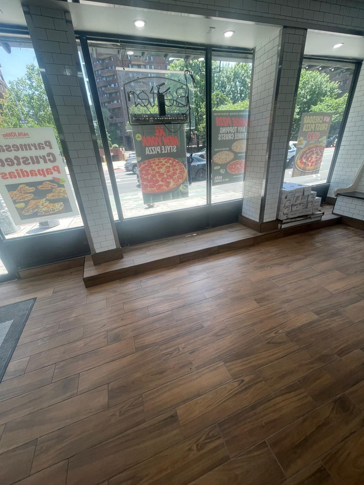 Front windows and wood-look plank flooring