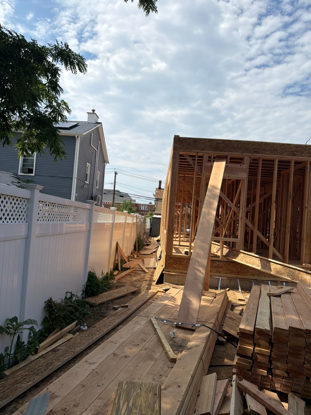 New framing going up beside a fence line