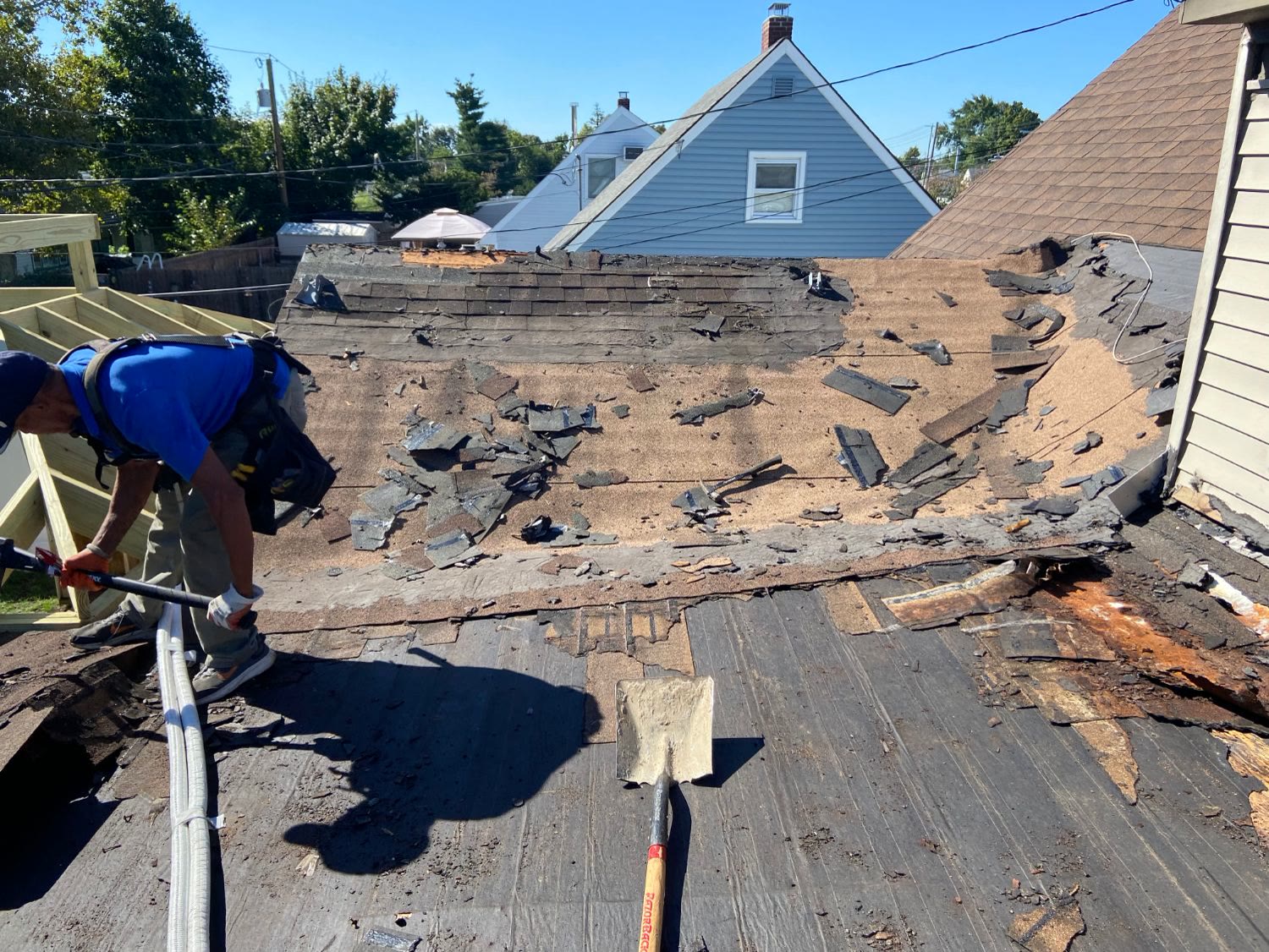 A roof stripped down to the deck before re-roofing